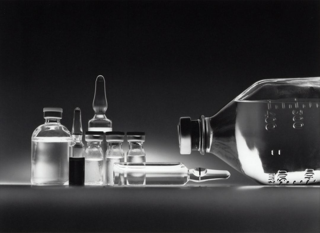 Variety of chemotherapy drugs in vials and an IV bottle.
